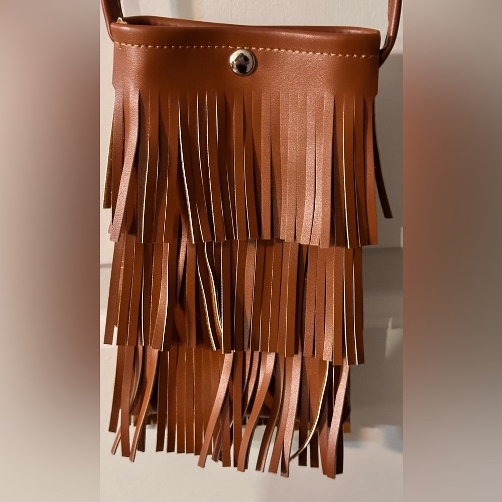 Small Fringe Cross Body. Fits a Large cell phone easily.